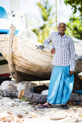 Maldivian fisherman gutting fish