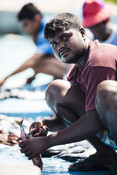Maldivian fisherman sitting on boat