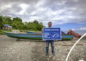 Fisherman with MSC partner sign - Indonesian Tuna