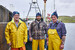 Crab fishers in front of vessel